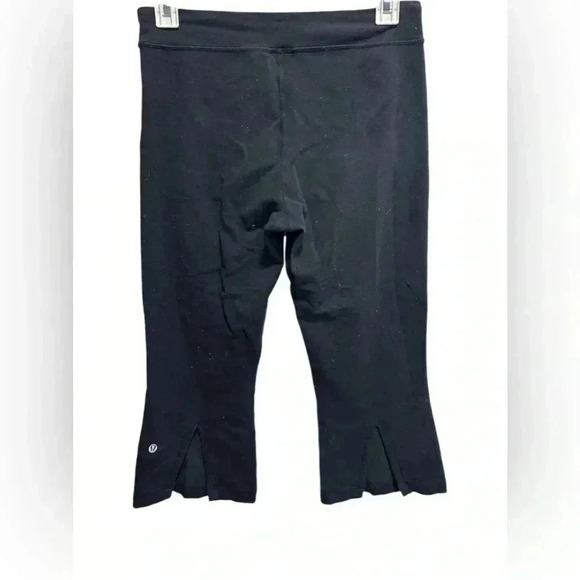LULULEMON BLACK CROPPED FLARE LEGGINGS WITH SLITS - Picture 1 of 4